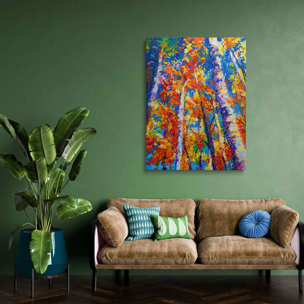 Fall birch and aspen painting with fall foliage canvas wall art print in orange and blue of original oil painting by Oregon Artist Talya Johnson featured in green painted room and beige sofa with blue pillows