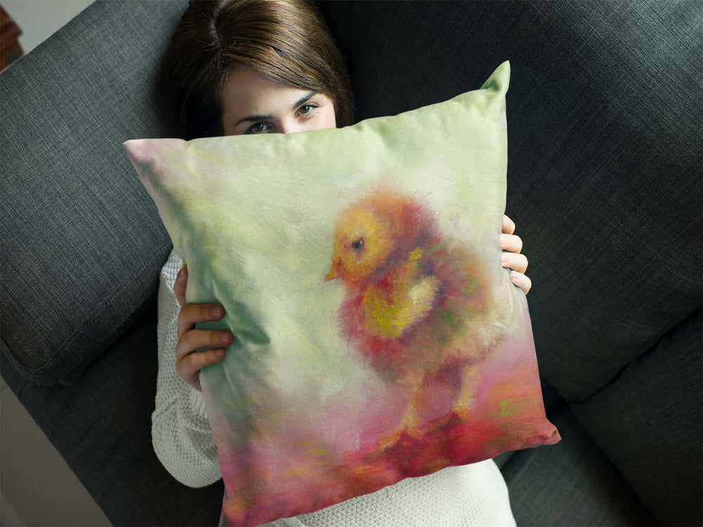 throw pillow with impressionist artwork of a baby chicken by talya johnson held by a young woman
