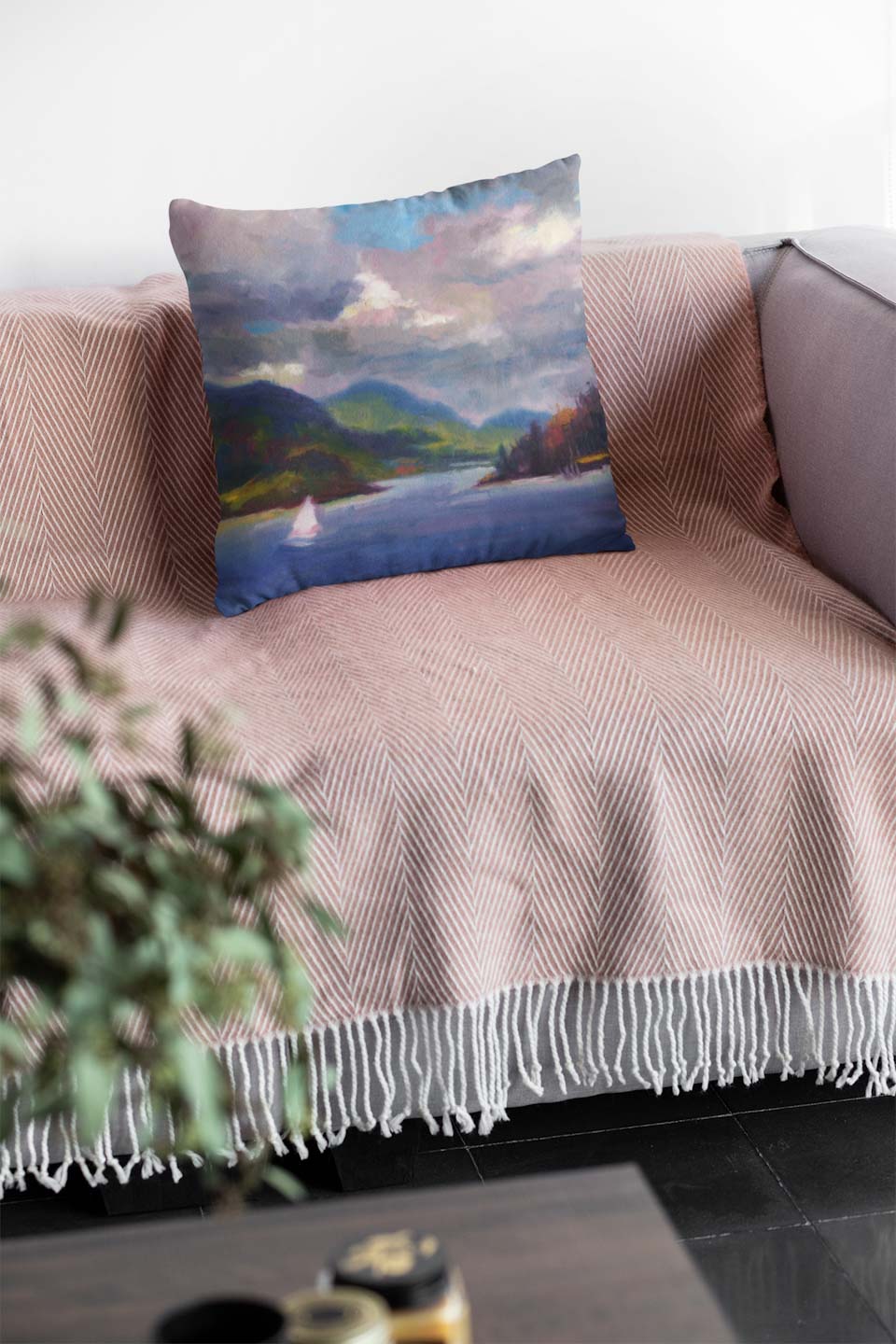 Custom throw pillow featuring original seascape painting of sailboat by Talya Johnson