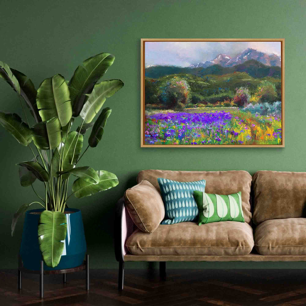 Modern decor with green wall  featuring framed Alaska art canvas print of original flower landscape painting painted with a palette knife in modern impressionism style depicting wild iris flower landscape with mountains and trees in the background.