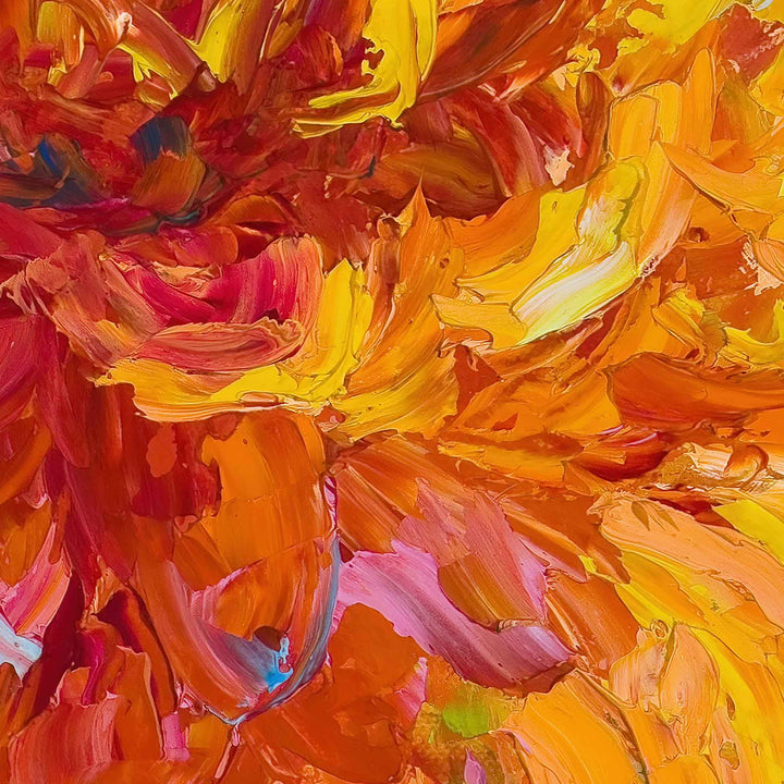 Detail close-up of palette knife and brush work of Passion, an impressionist palette knife vertical oil painting of two orange dahlias, with yellow outer petals and magenta red centers.