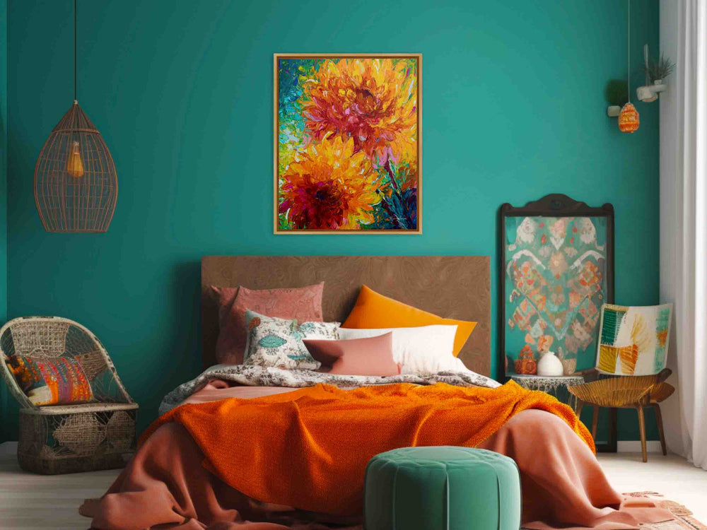 A large framed floral canvas print of oil painting titled Passion (an orange dahlias painting by Talya Johnson) hangs in a light filled colorful maximalist boho bedroom with orange and teal accents..