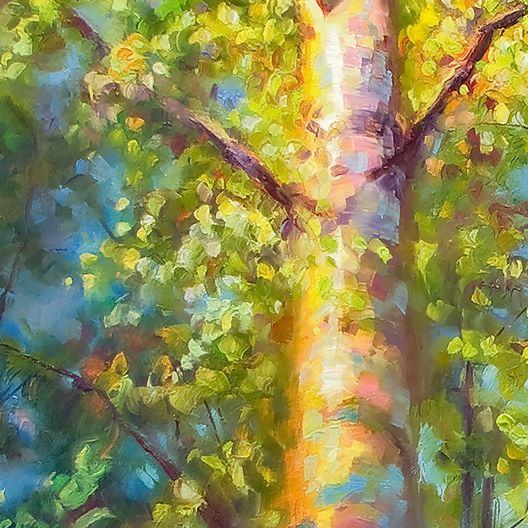 Close up detail of canvas print featuring colorful abstract painting of a tree with sunlight filtering through the leaves