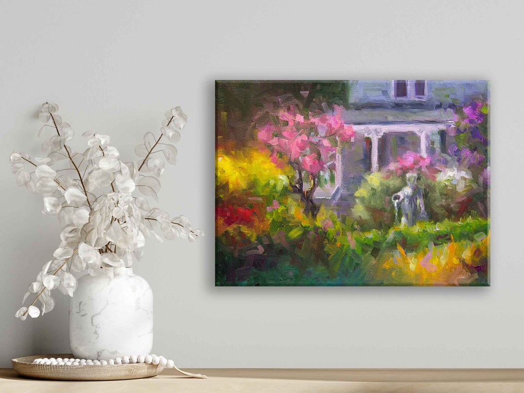 Strait on view of canvas wall art print of The Guardian, a plein air oil painting in modern impressionism of lilac garden painting landscape hanging over a shelf with vase, by Oregon Artist Taya Johnson