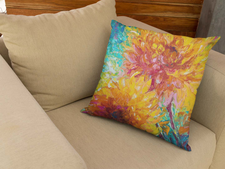 throw pillow on beige armchair Passion Throw Pillow home decor artwork featuring orange dahlia flowers by talya johnson