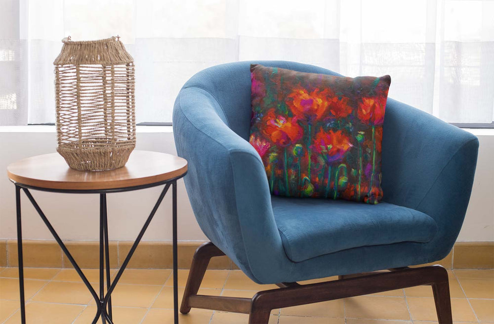 Up from the Ashes Throw Pillow featuring fiery red poppies by talya johnson home decor mockup with blue chair and desk